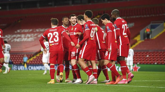 Liverpool vs Midtjylland Liverpools Diogo Jota, fourth left obscured, celebrates scoring his sides first goal during the Champions League Group D soccer match between Liverpool and FC Midtjylland at Anfield stadium, in Liverpool, England, Tuesday, Oct. 27, 2020. (Michael Regan/Pool via AP)