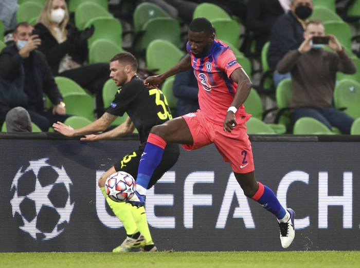 Krasnodars Marcus Berg, left, and Chelseas Antonio Rudiger challenge for the ball during the Champions League Group E soccer match between Krasnodar and Chelsea in Krasnodar, Russia, Wednesday, Oct. 28, 2020. (AP Photo)