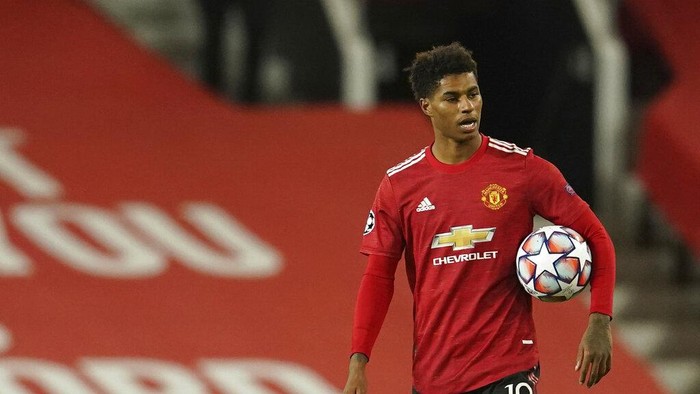 Manchester Uniteds Marcus Rashford walks end of the Champions League group H soccer match between Manchester United and RB Leipzig, at the Old Trafford stadium in Manchester, England, Wednesday, Oct. 28, 2020. (AP Photo/Dave Thompson)