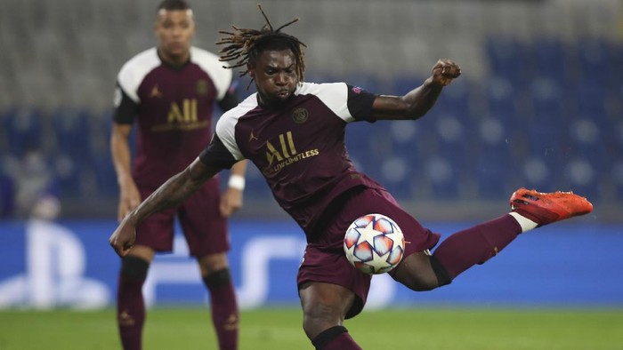PSGs Moise Kean shoots to score his second goal during the Champions League group H soccer match between Basaksehir and Paris Saint Germain in Istanbul, Wednesday, Oct. 28, 2020. (Tolga Bozoglu/Pool via AP)