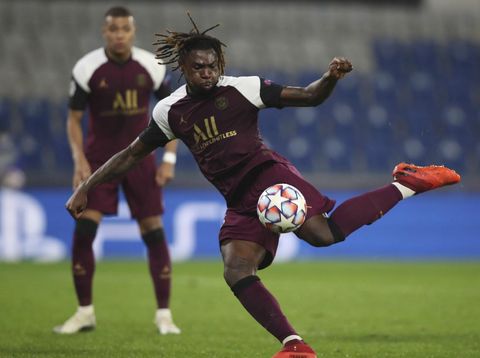 PSG's Moise Kean shoots to score his second goal during the Champions League group H soccer match between Basaksehir and Paris Saint Germain in Istanbul, Wednesday, Oct. 28, 2020. (Tolga Bozoglu/Pool via AP)