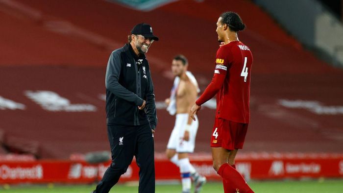Juergen Klopp LIVERPOOL, ENGLAND - JUNE 24: Jurgen Klopp, Manager of Liverpool celebrates with Virgil van Dijk of Liverpool after the Premier League match between Liverpool FC and Crystal Palace at Anfield on June 24, 2020 in Liverpool, England. (Phil Noble/Pool via Getty Images)