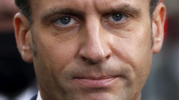French President Emmanuel Macron speaks to the media near Notre Dame church in Nice, southern France, Thursday, Oct. 29, 2020. French President Emmanuel Macron has announced that he will more than double number of soldiers deployed to protect against attacks to 7,000 after three people were killed at a church Thursday. (Eric Gaillard/Pool via AP)
