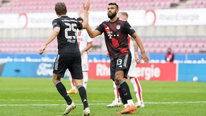 Bayern Munich COLOGNE, GERMANY - OCTOBER 31: Thomas Mueller of Bayern Munich celebrates with Eric Maxim Choupo-Moting of Bayern Munich after scoring his sides first goal during the Bundesliga match between 1. FC Koeln and FC Bayern Muenchen at RheinEnergieStadion on October 31, 2020 in Cologne, Germany. Sporting stadiums around Germany remain under strict restrictions due to the Coronavirus Pandemic as Government social distancing laws prohibit fans inside venues resulting in games being played behind closed doors. (Photo by Christian Kaspar-Bartke/Getty Images)