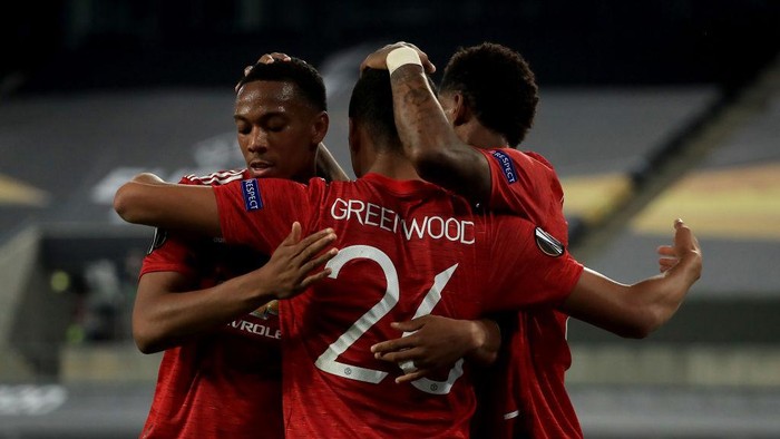 COLOGNE, GERMANY - AUGUST 10: Mason Greenwood of Manchester United celebrates with teammates Anthony Martial and Marcus Rashford after scoring a goal which is later disallowed during the UEFA Europa League Quarter Final between Manchester United and FC Kobenhavn at RheinEnergieStadion on August 10, 2020 in Cologne, Germany. (Photo by Wolfgang Rattay/Pool via Getty Images)