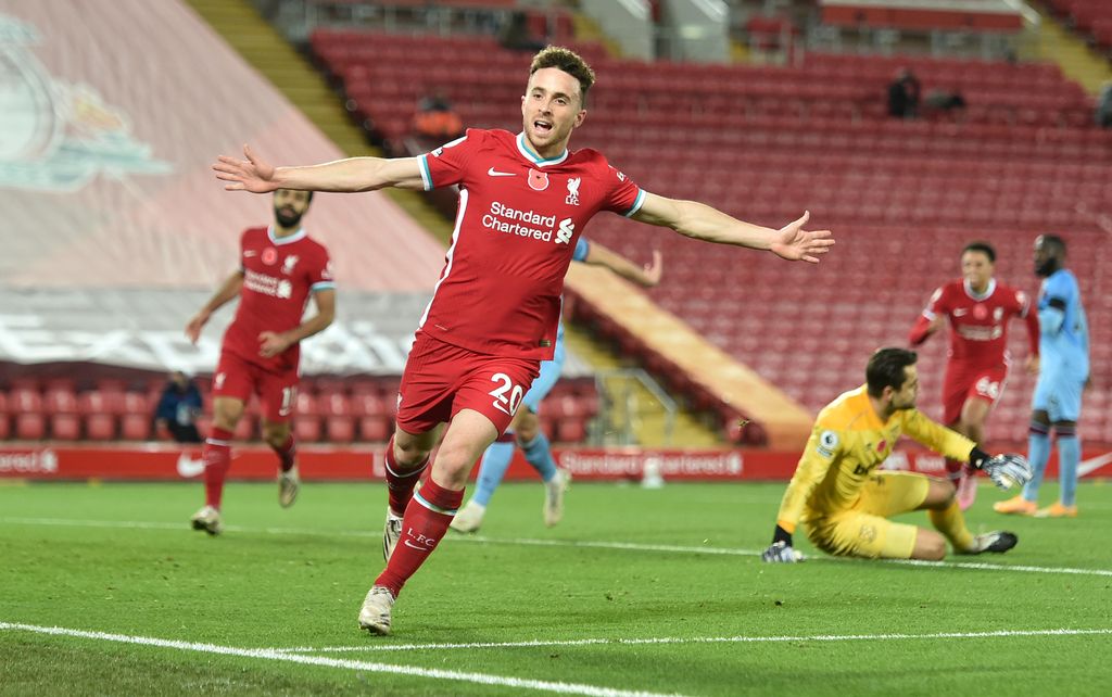 LIVERPOOL, ENGLAND - OCTOBER 31: Diogo Jota of Liverpool  celebrates after he scores his team's second goal  during the Premier League match between Liverpool and West Ham United at Anfield on October 31, 2020 in Liverpool, England. Sporting stadiums around the UK remain under strict restrictions due to the Coronavirus Pandemic as Government social distancing laws prohibit fans inside venues resulting in games being played behind closed doors. (Photo by Peter Powell - Pool/Getty Images)