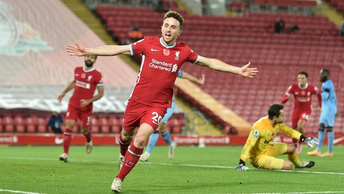 LIVERPOOL, ENGLAND - OCTOBER 31: Diogo Jota of Liverpool  celebrates after he scores his teams second goal  during the Premier League match between Liverpool and West Ham United at Anfield on October 31, 2020 in Liverpool, England. Sporting stadiums around the UK remain under strict restrictions due to the Coronavirus Pandemic as Government social distancing laws prohibit fans inside venues resulting in games being played behind closed doors. (Photo by Peter Powell - Pool/Getty Images)