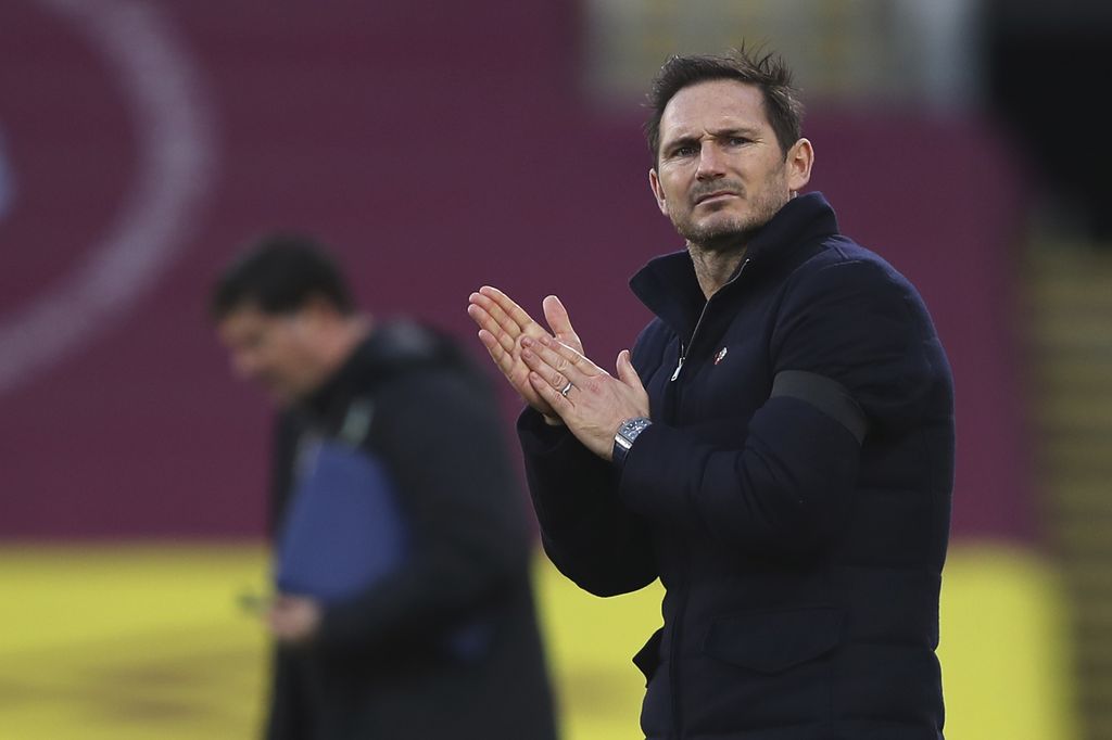 Chelsea's head coach Frank Lampard applauds at half time during the English Premier League soccer match between Burnley and Chelsea at Turf Moor stadium in Burnley, England, Saturday, Oct. 31, 2020. (Molly Darlington/Pool via AP)