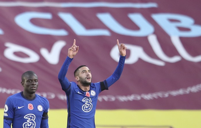 Chelseas Hakim Ziyech, right, celebrates after he scored his sides opening goal during an English Premier League soccer match between Burnley and Chelsea at the Turf Moor stadium in Burnley, England, Saturday Oct. 31, 2020. (Alex Pantling/Pool via AP)