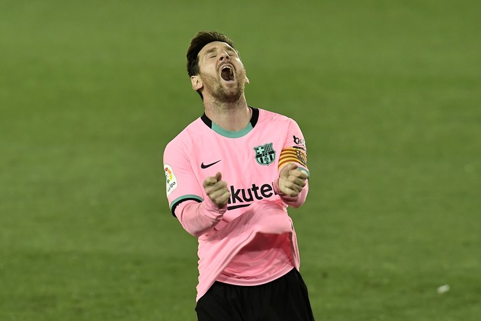 Barcelonas Lionel Messi gestures during the Spanish La Liga soccer match between Alaves and Barcelona at Mendizorroza stadium in Vitoria, Spain, Saturday, Oct. 31, 2020. (AP Photo/Alvaro Barrientos)