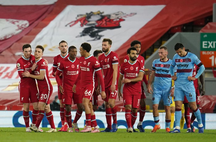 LIVERPOOL, ENGLAND - OCTOBER 31: Diogo Jota of Liverpool  celebrates after he scores his teams second goal  during the Premier League match between Liverpool and West Ham United at Anfield on October 31, 2020 in Liverpool, England. Sporting stadiums around the UK remain under strict restrictions due to the Coronavirus Pandemic as Government social distancing laws prohibit fans inside venues resulting in games being played behind closed doors. (Photo by Jon Super - Pool/Getty Images)