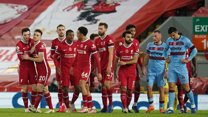 LIVERPOOL, ENGLAND - OCTOBER 31: Diogo Jota of Liverpool  celebrates after he scores his teams second goal  during the Premier League match between Liverpool and West Ham United at Anfield on October 31, 2020 in Liverpool, England. Sporting stadiums around the UK remain under strict restrictions due to the Coronavirus Pandemic as Government social distancing laws prohibit fans inside venues resulting in games being played behind closed doors. (Photo by Jon Super - Pool/Getty Images)