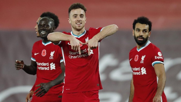 LIVERPOOL, ENGLAND - OCTOBER 31: Diogo Jota of Liverpool  celebrates after he scores his teams second goal  during the Premier League match between Liverpool and West Ham United at Anfield on October 31, 2020 in Liverpool, England. Sporting stadiums around the UK remain under strict restrictions due to the Coronavirus Pandemic as Government social distancing laws prohibit fans inside venues resulting in games being played behind closed doors. (Photo by Clive Brunskill/Getty Images)
