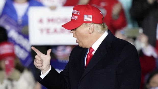 President Donald Trump gestures to supporters after speaking at a campaign rally on Sunday, Nov. 1, 2020, at Richard B. Russell Airport in Rome, Ga. (AP Photo/Brynn Anderson)