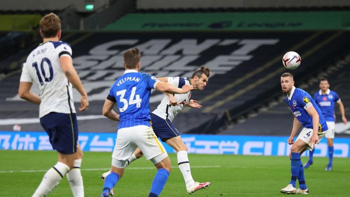 LONDON, ENGLAND - NOVEMBER 01: Gareth Bale of Tottenham Hotspur scores his sides second goal during the Premier League match between Tottenham Hotspur and Brighton & Hove Albion at Tottenham Hotspur Stadium on November 01, 2020 in London, England. Sporting stadiums around the UK remain under strict restrictions due to the Coronavirus Pandemic as Government social distancing laws prohibit fans inside venues resulting in games being played behind closed doors. (Photo by Julian Finney/Getty Images)