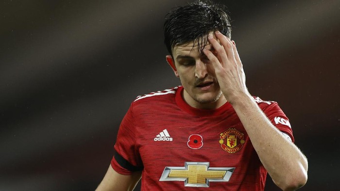 MANCHESTER, ENGLAND - NOVEMBER 01: Harry Maguire of Manchester United reacts during the Premier League match between Manchester United and Arsenal at Old Trafford on November 01, 2020 in Manchester, England. Sporting stadiums around the UK remain under strict restrictions due to the Coronavirus Pandemic as Government social distancing laws prohibit fans inside venues resulting in games being played behind closed doors. (Photo by Phil Noble - Pool/Getty Images)