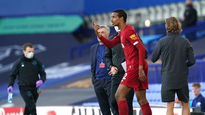 LIVERPOOL, ENGLAND - JUNE 21: Joel Matip of Liverpool reacts as he walks back on the pitch during the Premier League match between Everton FC and Liverpool FC at Goodison Park on June 21, 2020 in Liverpool, England. Football Stadiums around Europe remain empty due to the Coronavirus Pandemic as Government social distancing laws prohibit fans inside venues resulting in all fixtures being played behind closed doors. (Photo by Jon Super/Pool via Getty Images)
