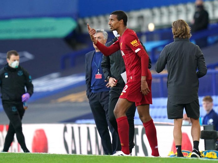 LIVERPOOL, ENGLAND - JUNE 21: Joel Matip of Liverpool reacts as he walks back on the pitch during the Premier League match between Everton FC and Liverpool FC at Goodison Park on June 21, 2020 in Liverpool, England. Football Stadiums around Europe remain empty due to the Coronavirus Pandemic as Government social distancing laws prohibit fans inside venues resulting in all fixtures being played behind closed doors. (Photo by Jon Super/Pool via Getty Images)