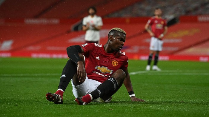 MANCHESTER, ENGLAND - NOVEMBER 01: Paul Pogba of Manchester United reacts after committing a foul leading to Arsenal being awarded a penalty during the Premier League match between Manchester United and Arsenal at Old Trafford on November 01, 2020 in Manchester, England. Sporting stadiums around the UK remain under strict restrictions due to the Coronavirus Pandemic as Government social distancing laws prohibit fans inside venues resulting in games being played behind closed doors. (Photo by Paul Ellis - Pool/Getty Images)