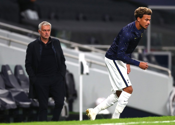 LONDON, ENGLAND - OCTOBER 01: Jose Mourinho, Manager of Tottenham Hotspur looks on as Dele Alli of Tottenham Hotspur warms up at half time during the UEFA Europa League play-off match between Tottenham Hotspur and Maccabi Haifa at Tottenham Hotspur Stadium on October 01, 2020 in London, England. Football Stadiums around Europe remain empty due to the Coronavirus Pandemic as Government social distancing laws prohibit fans inside venues resulting in fixtures being played behind closed doors. (Photo by Clive Rose/Getty Images)