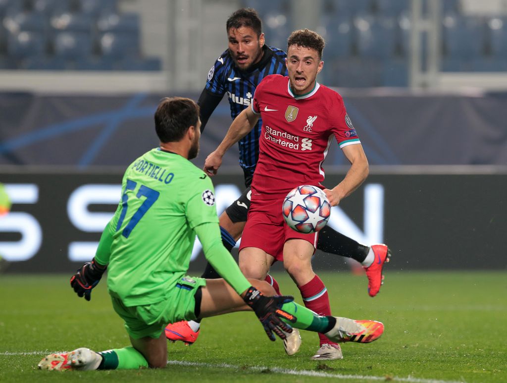 BERGAMO, ITALY - NOVEMBER 03:  Diogo Jota of Liverpool FC scores the opening goal during the UEFA Champions League Group D stage match between Atalanta BC and Liverpool FC at Gewiss Stadium on November 03, 2020 in Bergamo, Italy. (Photo by Emilio Andreoli/Getty Images)