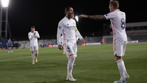 Real Madrid's Sergio Ramos, center, after scoring his side's second goal during the Champions League group B soccer match between Real Madrid and Inter Milan at the Alfredo Di Stefano stadium in Madrid, Spain, Tuesday, Nov. 3, 2020. (AP Photo/Bernat Armangue)