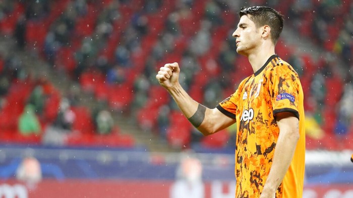 Juventus Alvaro Morata celebrates after scoring the opening goal during the Champions League Group G soccer match between Ferencvaros and Juventus at the Puskas Arena in Budapest, Hungary, Wednesday, Nov. 4, 2020. (AP Photo/Laszlo Balogh)