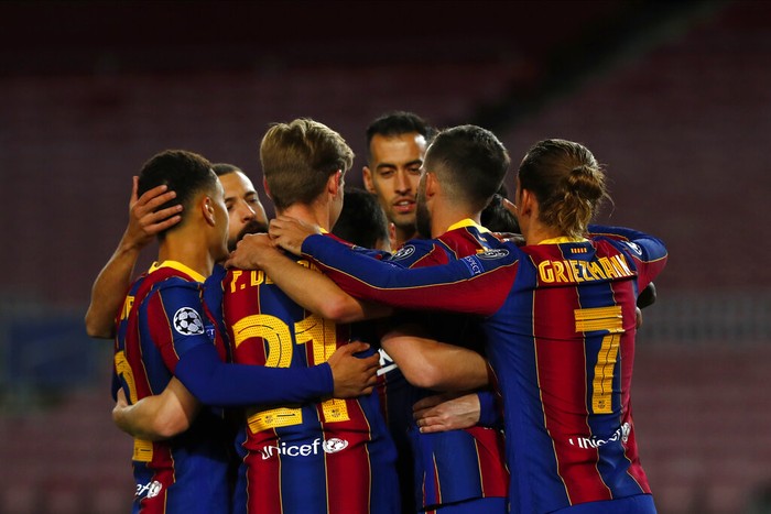 Barcelonas Lionel Messi celebrates with teammates after scoring from a penalty kick during the Champions League group G soccer match between FC Barcelona and Dynamo Kyiv at the Camp Nou stadium in Barcelona, Spain, Wednesday, Nov. 4, 2020. (AP Photo/Joan Monfort)
