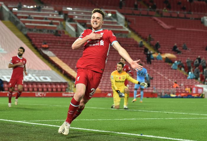 Diogo Jota LIVERPOOL, ENGLAND - OCTOBER 31: Diogo Jota of Liverpool celebrates after he scores his teams second goal during the Premier League match between Liverpool and West Ham United at Anfield on October 31, 2020 in Liverpool, England. Sporting stadiums around the UK remain under strict restrictions due to the Coronavirus Pandemic as Government social distancing laws prohibit fans inside venues resulting in games being played behind closed doors. (Photo by Peter Powell - Pool/Getty Images)