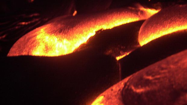 A large surface flow of lava from the Kilauea Volcano eruption heads for the pacific ocean late Sunday, Aug. 18, 2002, at Volcanoes National Park near Volcano, Hawaii. When the sun goes down over Kilauea streams of lava light up the hillside  in an orange glow as it flows toward the sea AP Photo Ronen Zilberman)