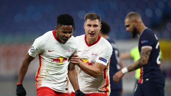LEIPZIG, GERMANY - NOVEMBER 04: Christopher Nkunku of RB Leipzig celebrates after scoring his teams first goal during the UEFA Champions League Group H stage match between RB Leipzig and Paris Saint-Germain at Red Bull Arena on November 04, 2020 in Leipzig, Germany. Sporting stadiums around Germany remain under strict restrictions due to the Coronavirus Pandemic as Government social distancing laws prohibit fans inside venues resulting in games being played behind closed doors. (Photo by Maja Hitij/Getty Images)