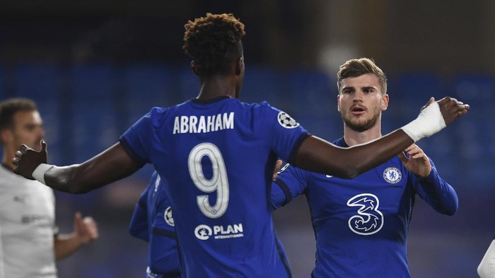 Chelseas Timo Werner, right, celebrates after scoring the opening goal during the Champions League Group E soccer match between Chelsea and Rennes at Stamford Bridge, London, England, Wednesday Nov. 4, 2020. (Ben Stansall/Pool via AP)