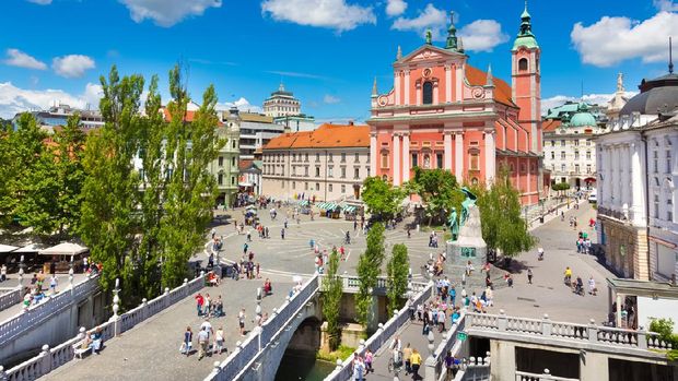 Romantic Ljubljana city center. River Ljubljanica, Triple Bridge - Tromostovje, Preseren square and Franciscan Church of the Annunciation. Ljubljana Slovenia Europe.