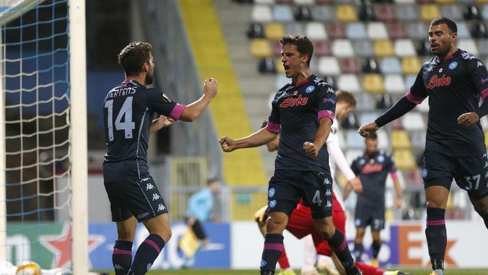 Napolis Diego Demme, centre, celebrates after scoring his sides opening goal during the Europa League Group F soccer match between Rijeka and Napoli at the Rujevica stadium in Rijeka, Croatia, Thursday, Nov. 5, 2020. (AP Photo/Darko Bandic)