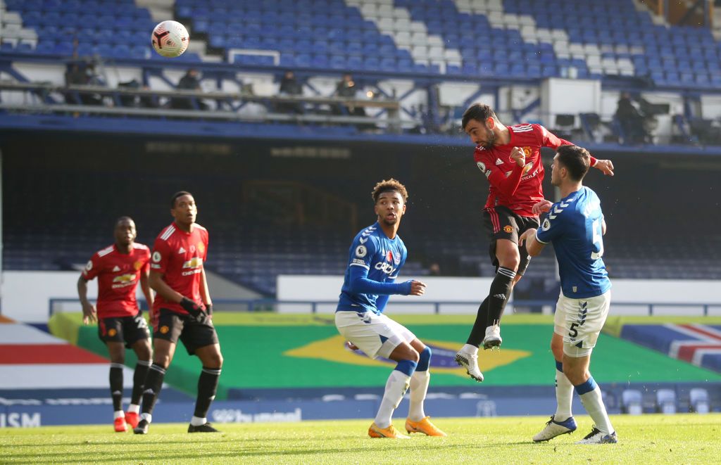 Everton Vs Manchester United LIVERPOOL, ENGLAND - NOVEMBER 07: Michael Keane of Everton competes for a header with Anthony Martial of Manchester United during the Premier League match between Everton and Manchester United at Goodison Park on November 07, 2020 in Liverpool, England. Sporting stadiums around the UK remain under strict restrictions due to the Coronavirus Pandemic as Government social distancing laws prohibit fans inside venues resulting in games being played behind closed doors. (Photo by Paul Ellis - Pool/Getty Images)