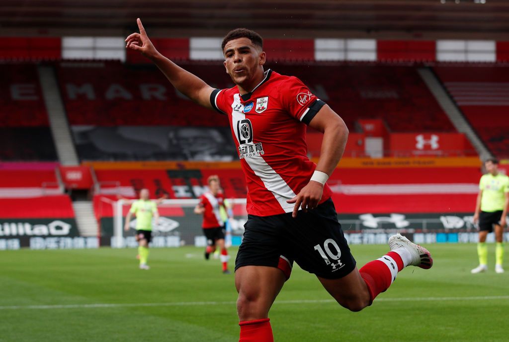 SOUTHAMPTON, ENGLAND - NOVEMBER 06: Southampton player  Che Adams celebrates his opening goal with Moussa Djenepo (l) during the Premier League match between Southampton and Newcastle United at St Mary's Stadium on November 06, 2020 in Southampton, England. Sporting stadiums around the UK remain under strict restrictions due to the Coronavirus Pandemic as Government social distancing laws prohibit fans inside venues resulting in games being played behind closed doors. (Photo by Stu Forster/Getty Images)