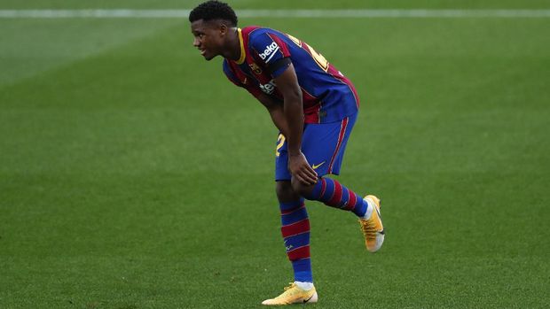 Barcelona's Ansu Fati, gestures after he was fouled by Betis' Aissa Mandi during the Spanish La Liga soccer match between FC Barcelona and Betis at the Camp Nou stadium in Barcelona, Spain, Saturday, Nov. 7, 2020. (AP Photo/Joan Monfort)