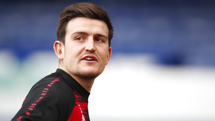Manchester Uniteds Harry Maguire warms up ahead of the English Premier League soccer match between Everton and Manchester United at the Goodison Park stadium in Liverpool, England, Saturday, Nov. 7, 2020. (Clive Brunskill/Pool via AP)