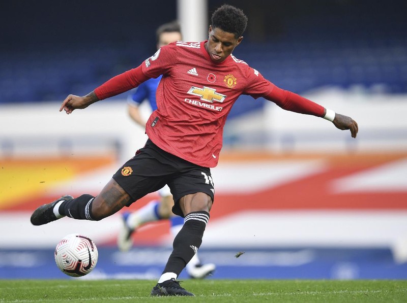Manchester United's Marcus Rashford in action during the English Premier League soccer match between Everton and Manchester United at the Goodison Park stadium in Liverpool, England, Saturday, Nov. 7, 2020. (Paul Ellis/Pool via AP)