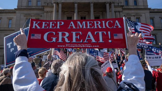Supporters of US President Donald Trump rally at the State Capitol in Lansing, Michigan, on November 7, 2020, after Democratic Presidential nominee Joe Biden was declared the winner of the 2020 US elections. (Photo by SETH HERALD / AFP)