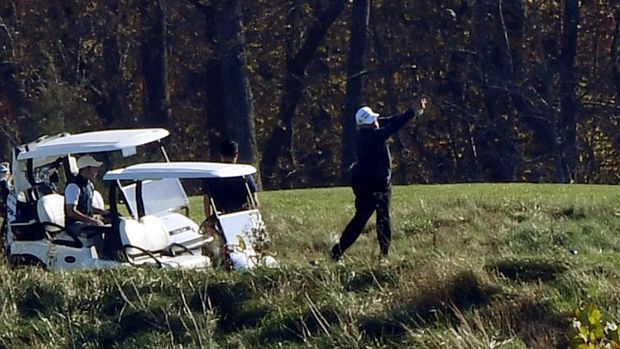 US President Donald Trump golfs at Trump National Golf Club on November 7, 2020 in Sterling, Virginia. - Democrat Joe Biden has won the White House, US media said November 7, defeating Donald Trump and ending a presidency that convulsed American politics, shocked the world and left the United States more divided than at any time in decades. (Photo by Olivier DOULIERY / AFP)