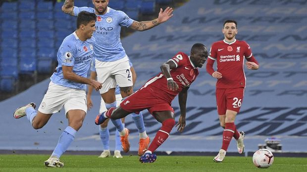 Liverpool's Sadio Mane is fouled for a penalty during the English Premier League soccer match between Manchester City and Liverpool at the Etihad stadium in Manchester, England, Sunday, Nov. 8, 2020. (Shaun Botterill/Pool via AP)