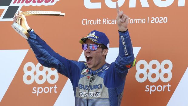 Spain's rider Joan Mir of the Team SUZUKI ECSTAR celebrates his victory on the podium after wining the MotoGP race during the European Grand Prix in Valencia, Spain, Sunday, Nov. 8, 2020. (AP Photo/Alberto Saiz)