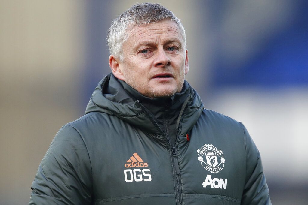 Manchester United's manager Ole Gunnar Solskjaer walks to the bench during the English Premier League soccer match between Everton and Manchester United at the Goodison Park stadium in Liverpool, England, Saturday, Nov. 7, 2020. (Clive Brunskill/Pool via AP)