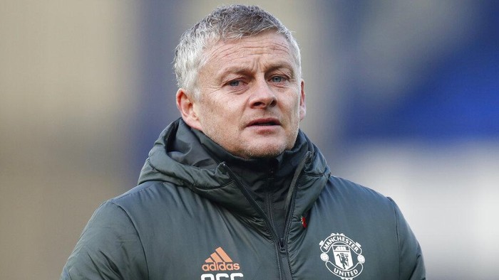 Manchester Uniteds manager Ole Gunnar Solskjaer walks to the bench during the English Premier League soccer match between Everton and Manchester United at the Goodison Park stadium in Liverpool, England, Saturday, Nov. 7, 2020. (Clive Brunskill/Pool via AP)