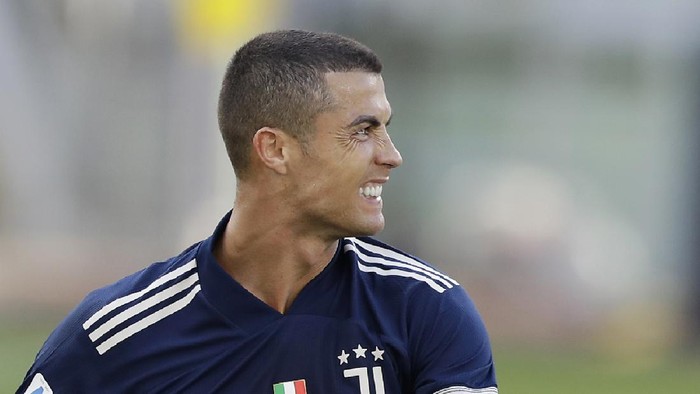 Juventus Cristiano Ronaldo sits on the field after a challenge during the Serie A soccer match between Lazio and Juventus at the Olympic stadium in Rome, Sunday, Nov. 8, 2020. (AP Photo/Andrew Medichini)