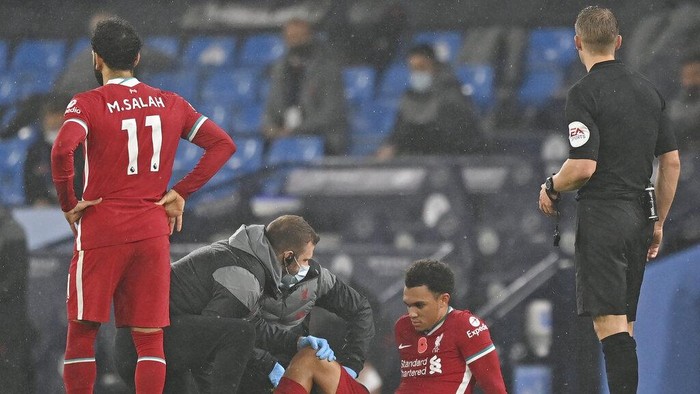 Liverpools Trent Alexander-Arnold gets treatment after getting injured during the English Premier League soccer match between Manchester City and Liverpool at the Etihad stadium in Manchester, England, Sunday, Nov. 8, 2020. (Shaun Botterill/Pool via AP)