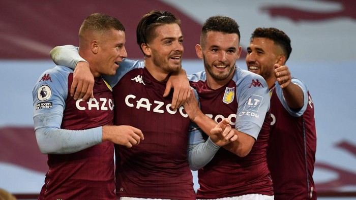 BIRMINGHAM, ENGLAND - OCTOBER 04: Jack Grealish of Aston Villa  celebrates after scoring his teams sixth goal  during the Premier League match between Aston Villa and Liverpool at Villa Park on October 04, 2020 in Birmingham, England. Sporting stadiums around the UK remain under strict restrictions due to the Coronavirus Pandemic as Government social distancing laws prohibit fans inside venues resulting in games being played behind closed doors. (Photo by Peter Powell - Pool/Getty Images)