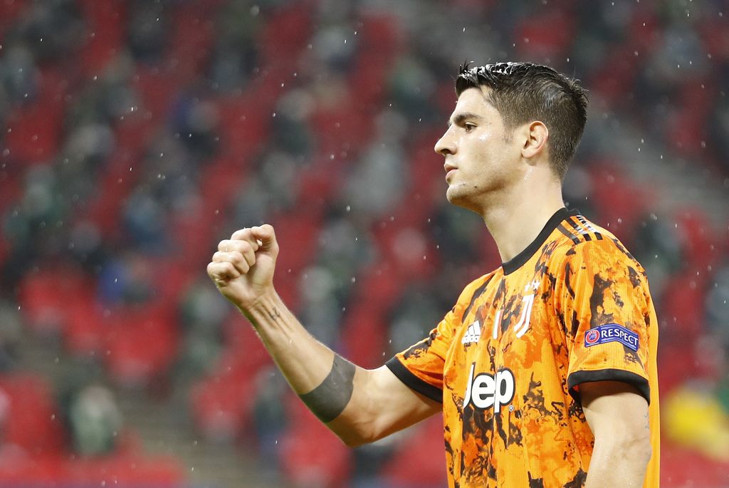 Juventus' Alvaro Morata celebrates after scoring the opening goal during the Champions League Group G soccer match between Ferencvaros and Juventus at the Puskas Arena in Budapest, Hungary, Wednesday, Nov. 4, 2020. (AP Photo/Laszlo Balogh)