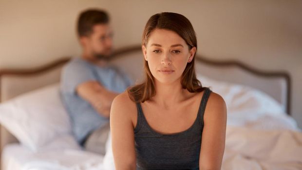 Disloyal boyfriend caught by his angry girlfriend dating with another girl in a restaurant